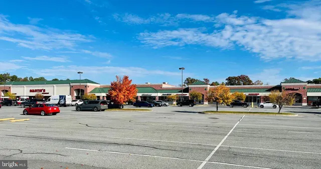 a view of street with parked cars