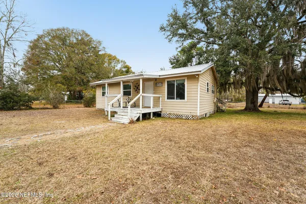 a house with trees in front of it