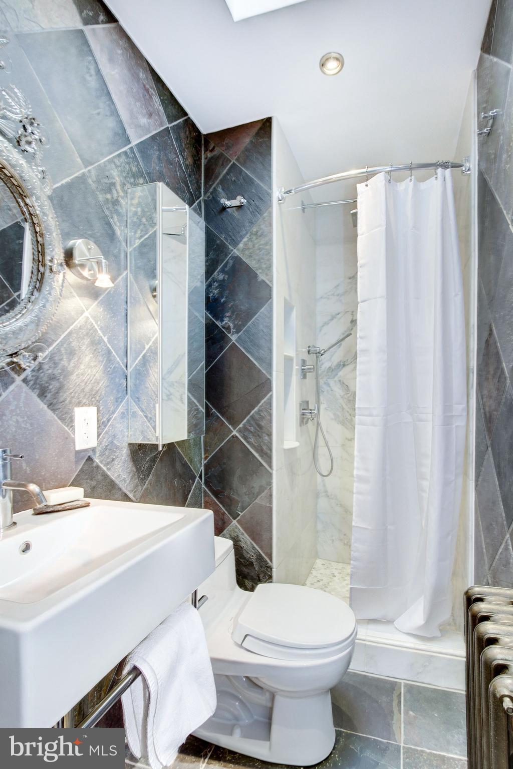 3816 Calvert Street Northwest Washington, DC 20007 - Photo 15 of 30 En-suite renovated bathroom