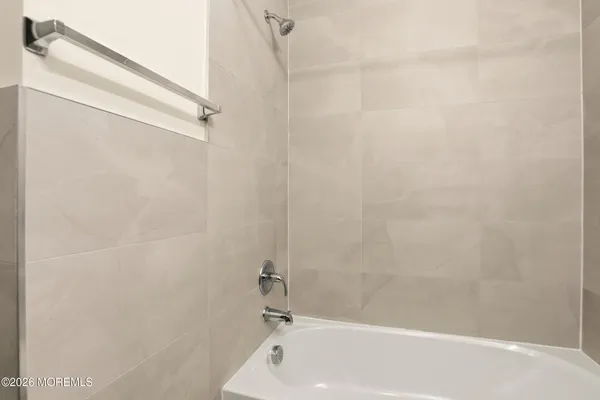 a bathroom with a sink and a bathtub