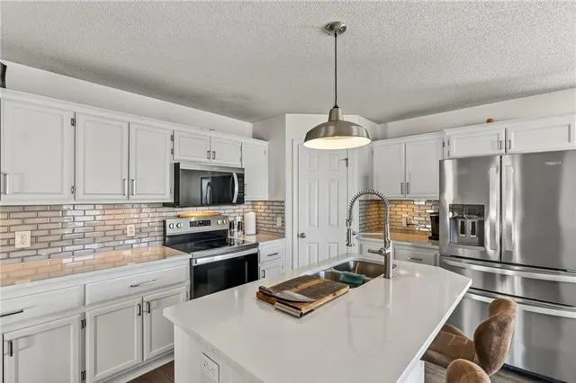 $365,000 | 9305 Northeast Paw Paw Drive, Kansas City, MO 64157