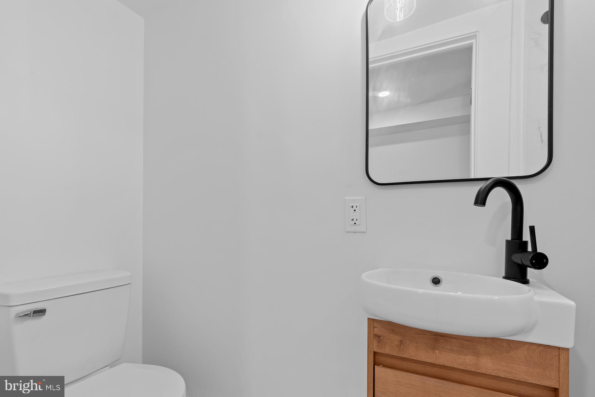 939 Shepherd Street Northwest Washington, DC 20011 - Photo 21 of 45 a bathroom with a toilet and a sink