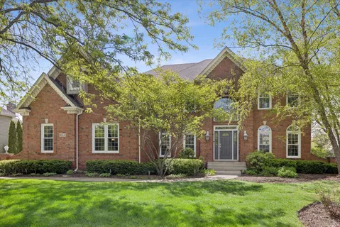 front view of a house with a yard