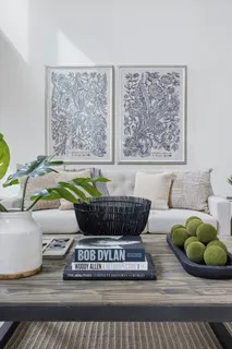 a view of living room filled with furniture and rug