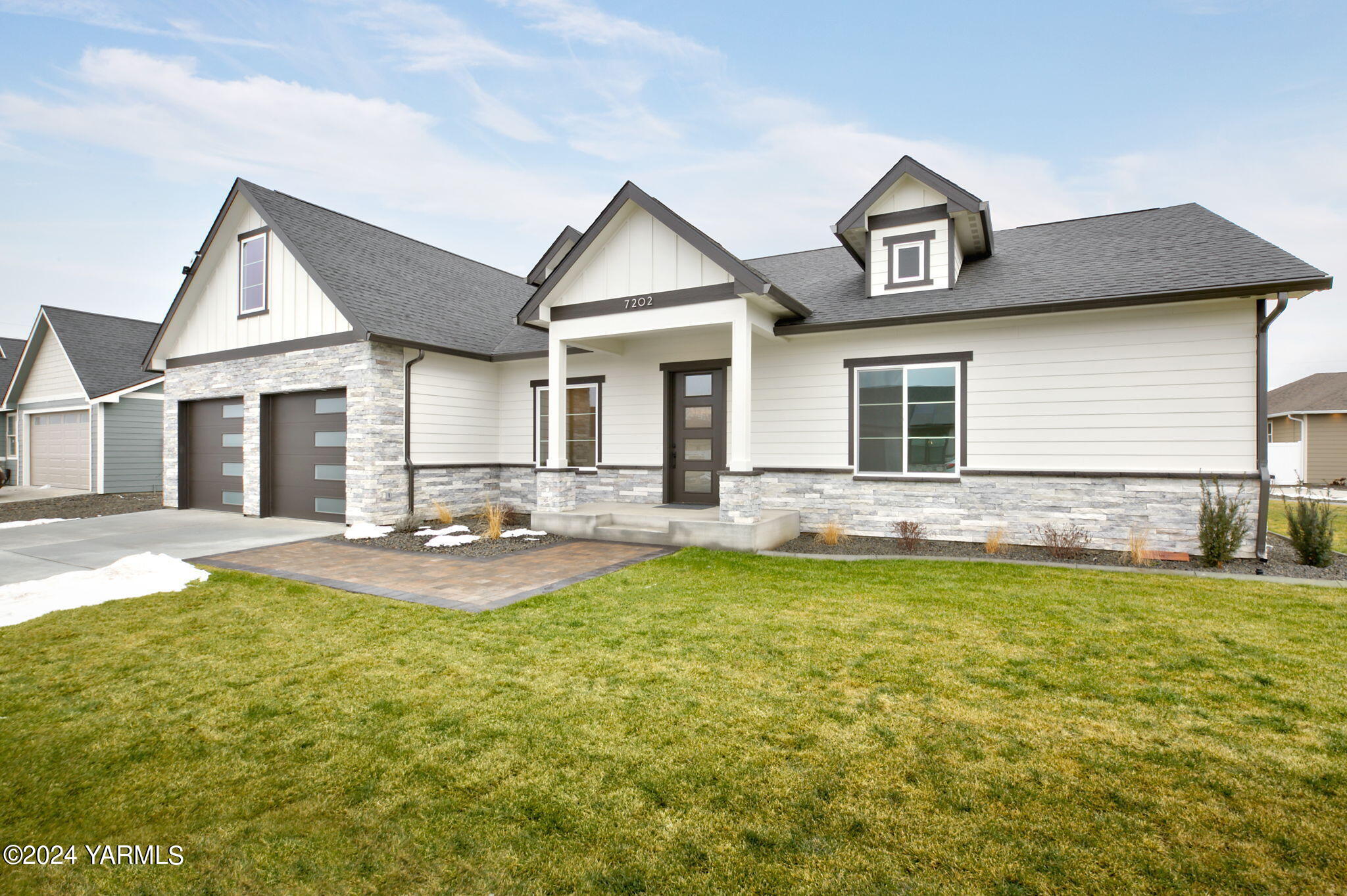 a view of a house with swimming pool and porch