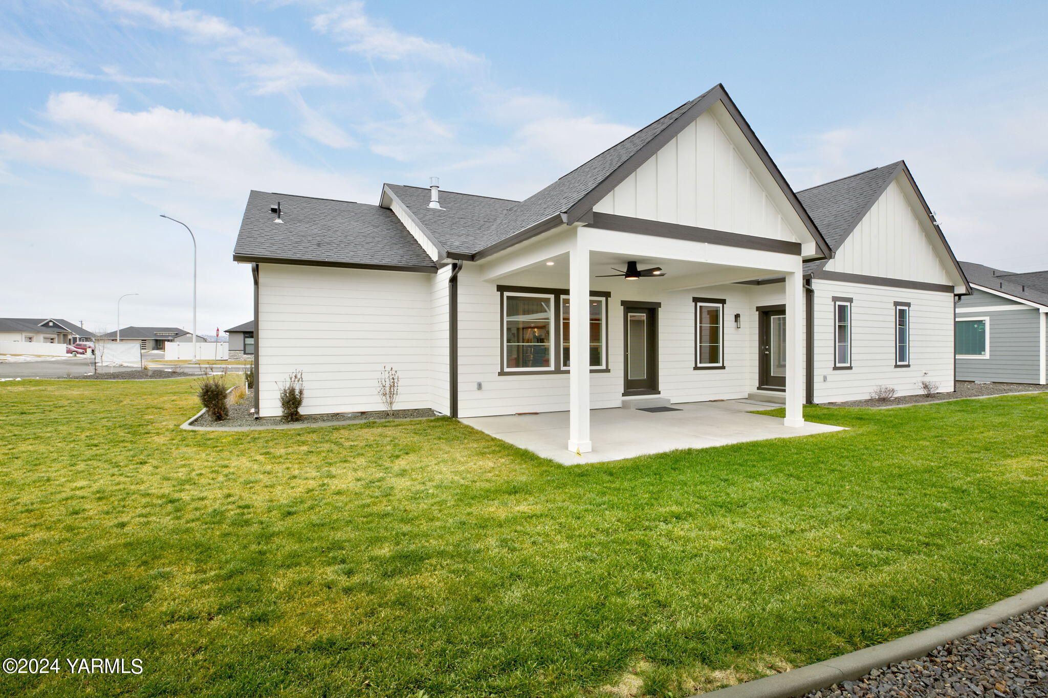 7202 Vista Ridge Avenue Yakima, WA 98903 - Photo 2 of 24 a big house with a big yard and more windows