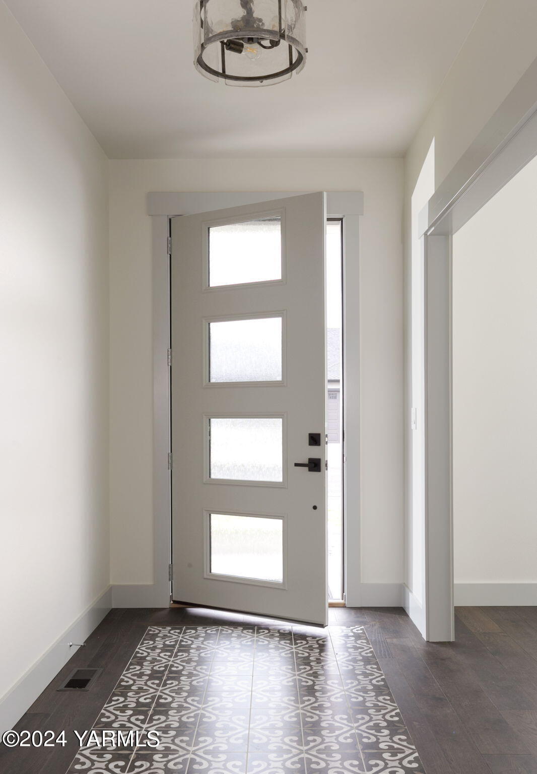 7202 Vista Ridge Avenue Yakima, WA 98903 - Photo 4 of 24 wooden floor in an empty room with a window