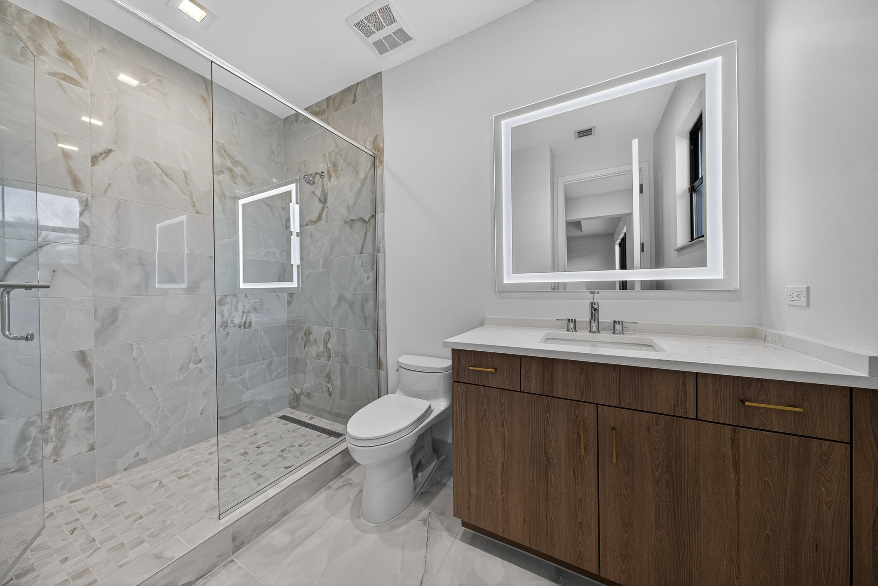 9361 Sunflower Mdw Road Boca Raton, FL 33434 - Photo 19 of 39 a bathroom with a sink toilet a mirror and shower