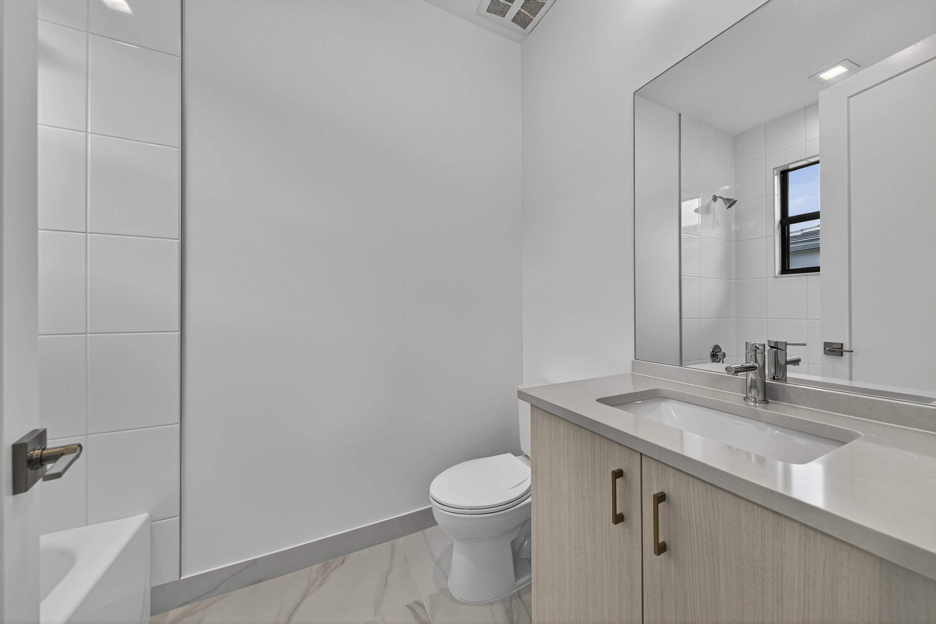 9361 Sunflower Mdw Road Boca Raton, FL 33434 - Photo 21 of 39 a bathroom with a sink toilet and vanity