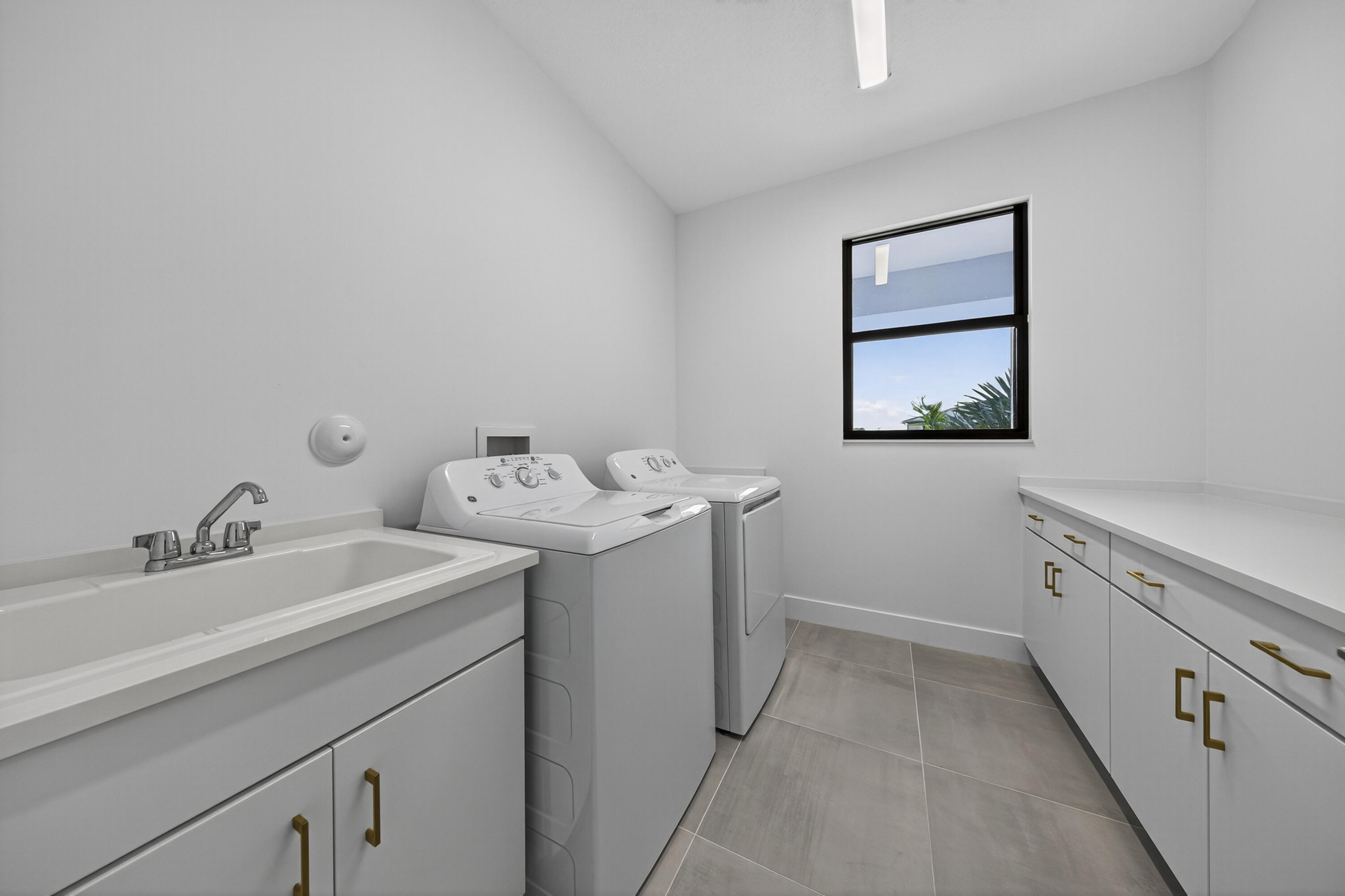 9361 Sunflower Mdw Road Boca Raton, FL 33434 - Photo 26 of 39 Upstairs Laundry