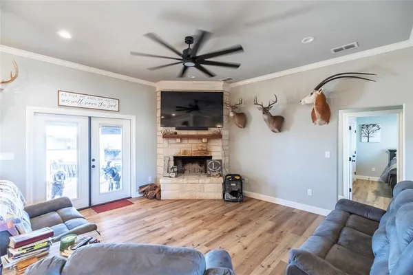 a bedroom with furniture and a large window