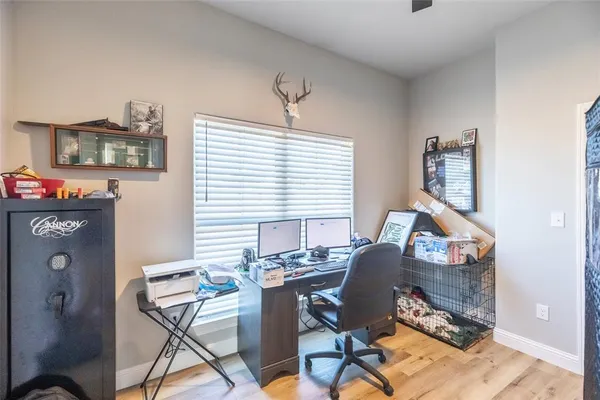 a workspace with furniture and a window
