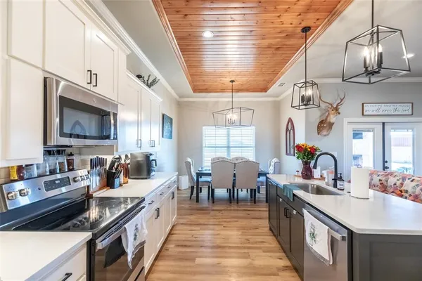a large kitchen with lots of counter space and a sink