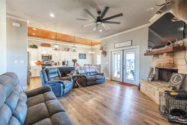 a living room with furniture fireplace and a flat screen tv
