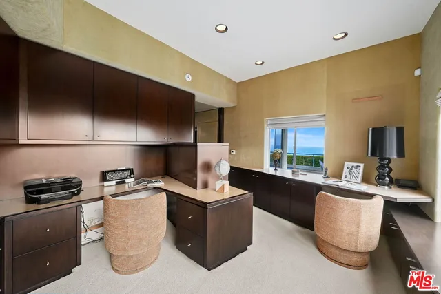 a kitchen with a sink and a stove top oven