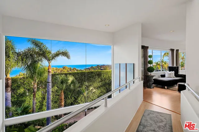 a view of a floor to ceiling window and an outdoor view