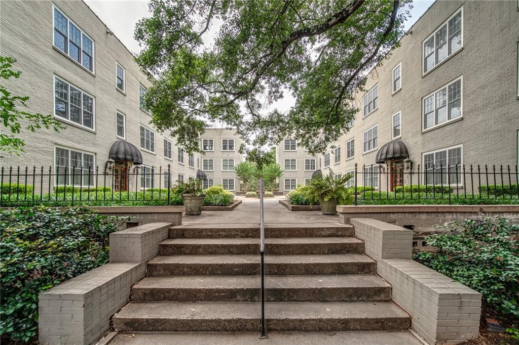 28 Collier Road Northwest, Unit 4 Atlanta, GA 30309 - Photo 1 of 1 a view of a building with stairs and bench