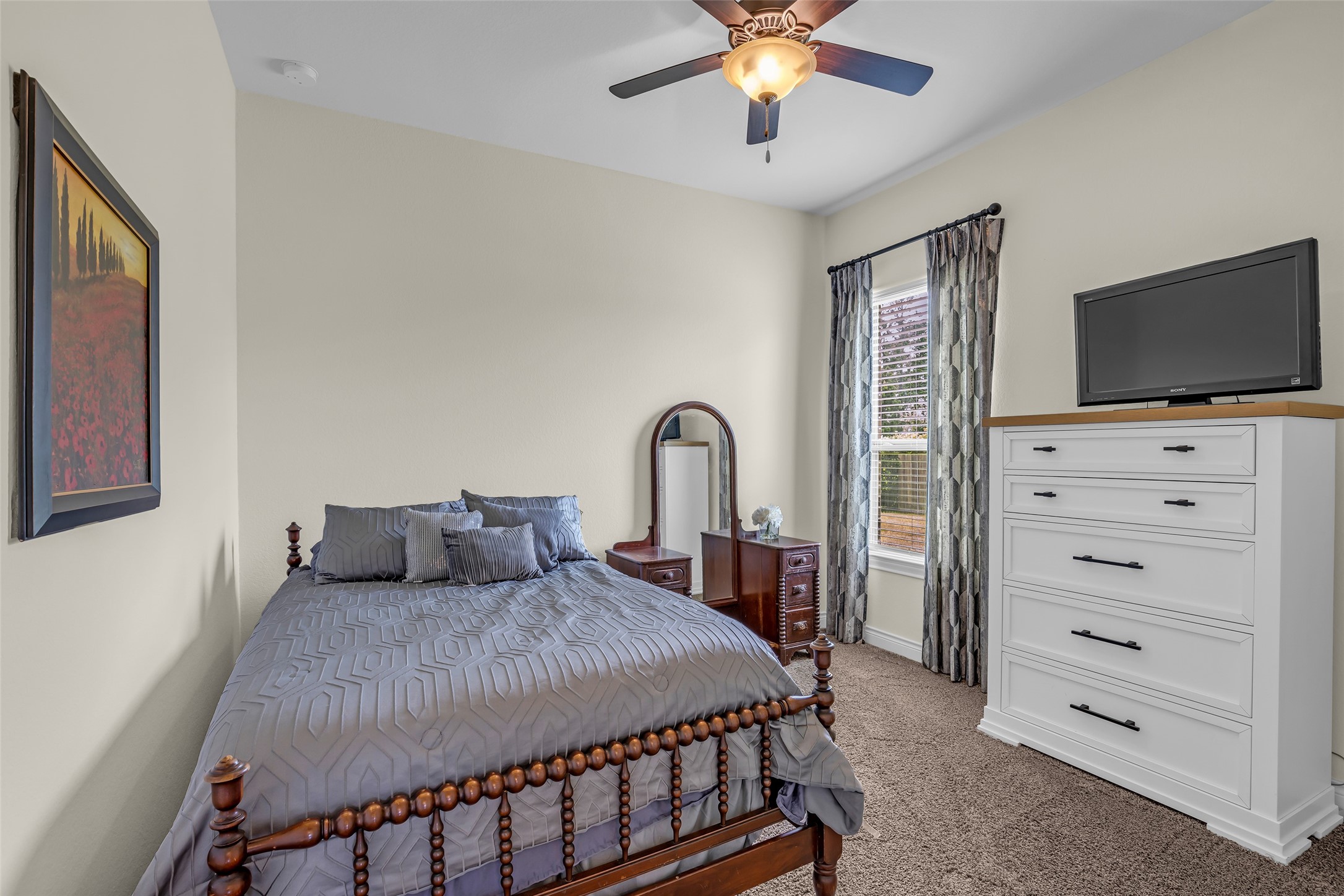 14003 South Evergreen Ridge Court Conroe, TX 77384 - Photo 29 of 43 Another spacious secondary bedroom with abundant natural light and generous closet space.