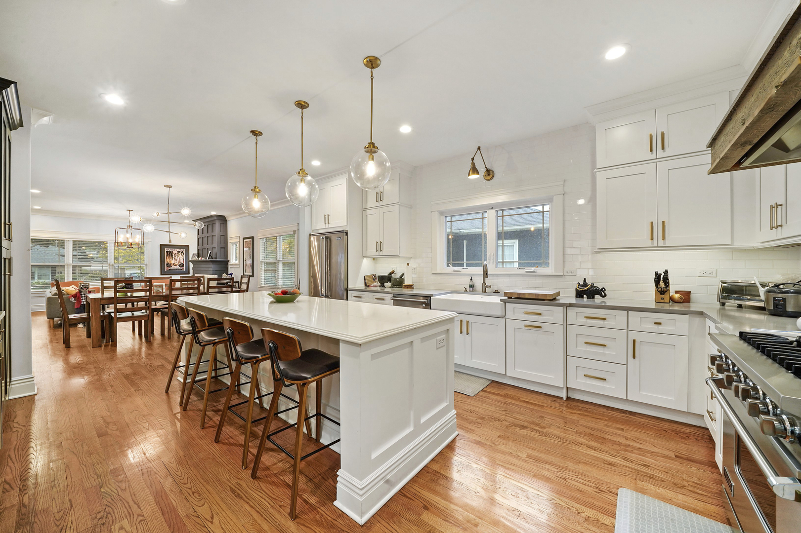 295 Herrick Road Riverside, IL 60546 - Photo 11 of 32 a large white kitchen with lots of counter space and a sink