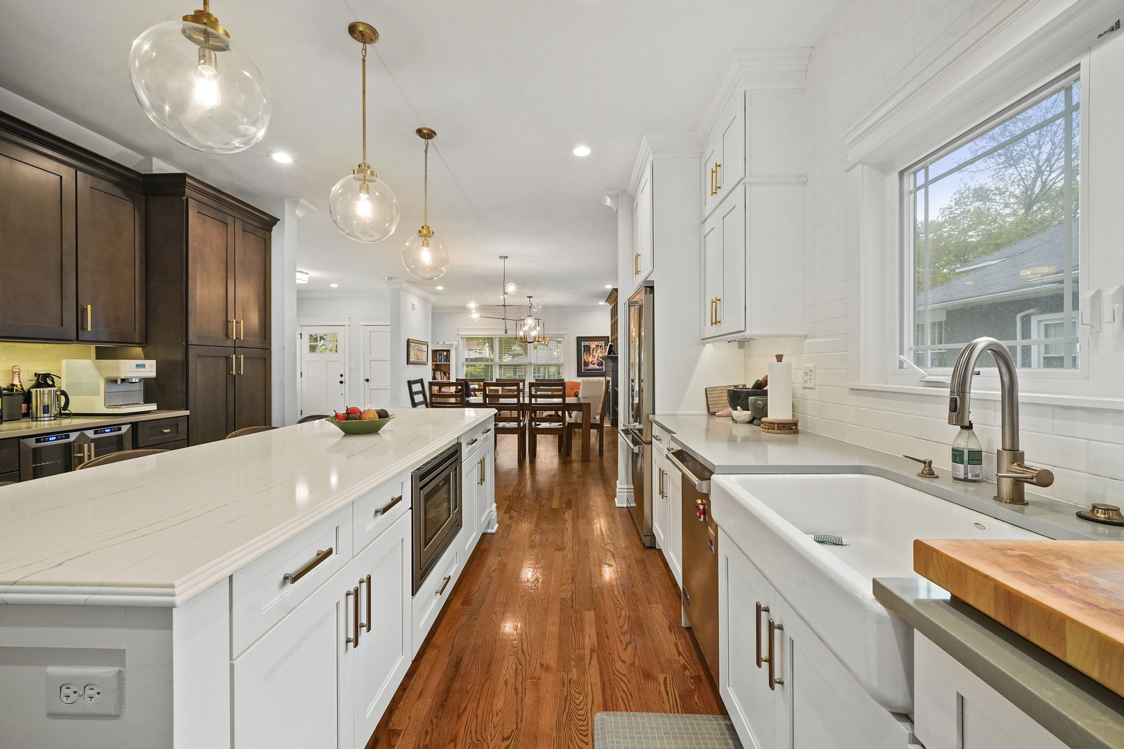 295 Herrick Road Riverside, IL 60546 - Photo 12 of 32 a large kitchen with stainless steel appliances granite countertop a lot of counter space and wooden floors
