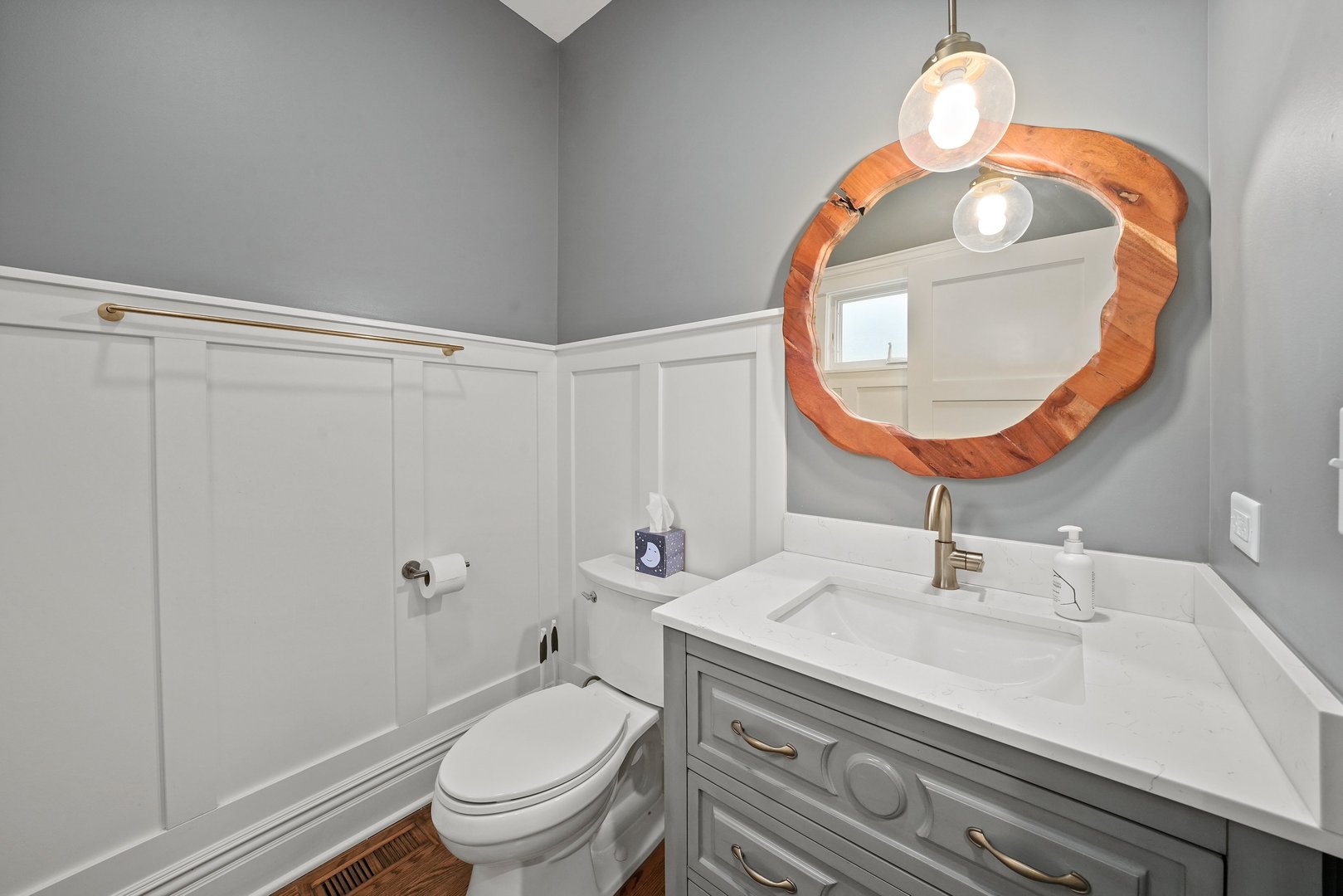 295 Herrick Road Riverside, IL 60546 - Photo 15 of 32 a bathroom with a sink a toilet and a mirror