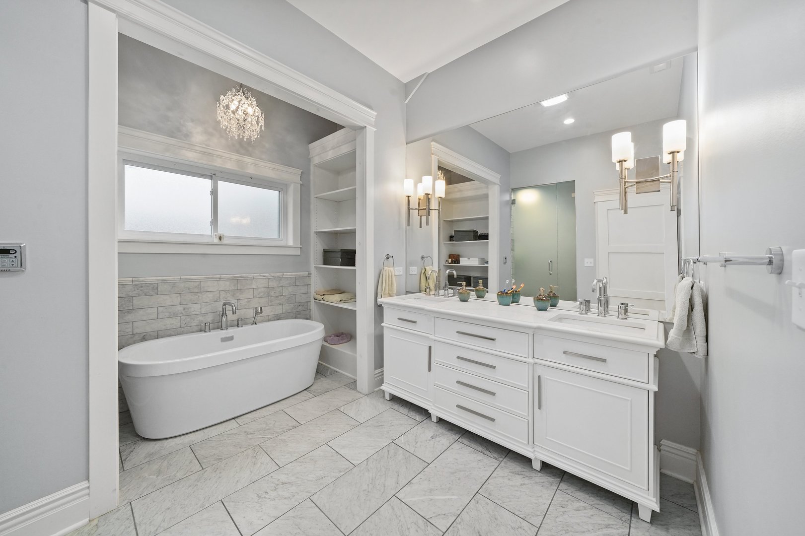 295 Herrick Road Riverside, IL 60546 - Photo 16 of 32 a bathroom with a double vanity sink a toilet a mirror and bathtub