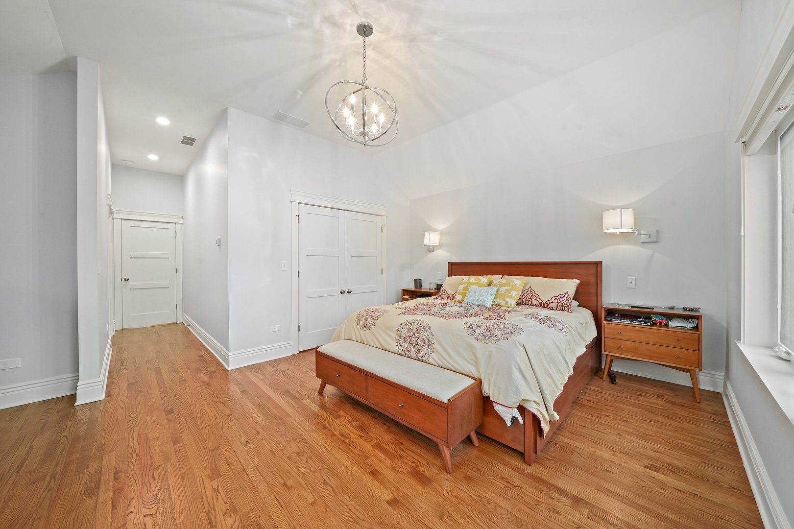 295 Herrick Road Riverside, IL 60546 - Photo 19 of 32 a spacious bedroom with a bed and wooden floor