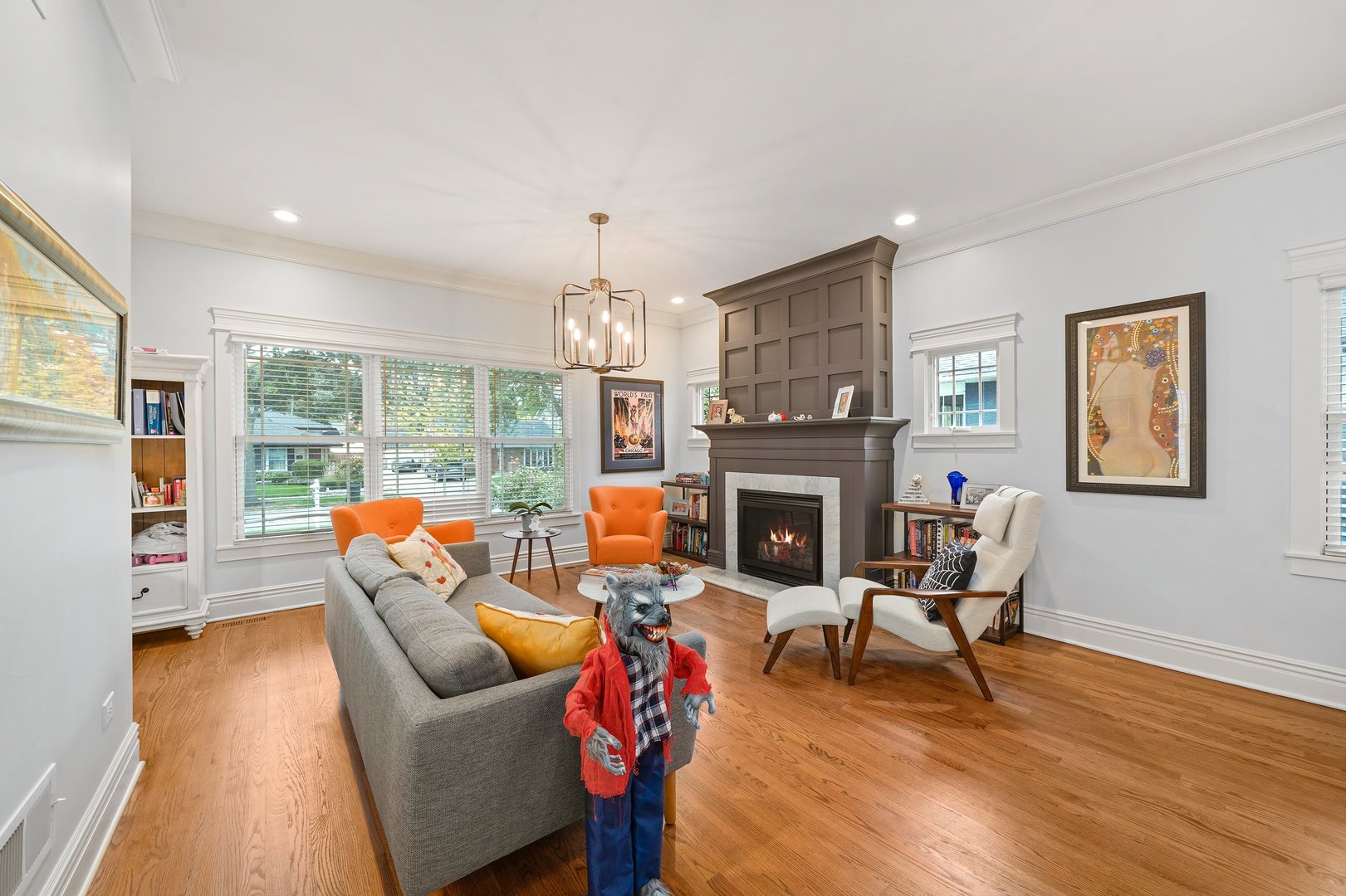 295 Herrick Road Riverside, IL 60546 - Photo 5 of 32 a living room with furniture a fireplace and a dining table with wooden floor