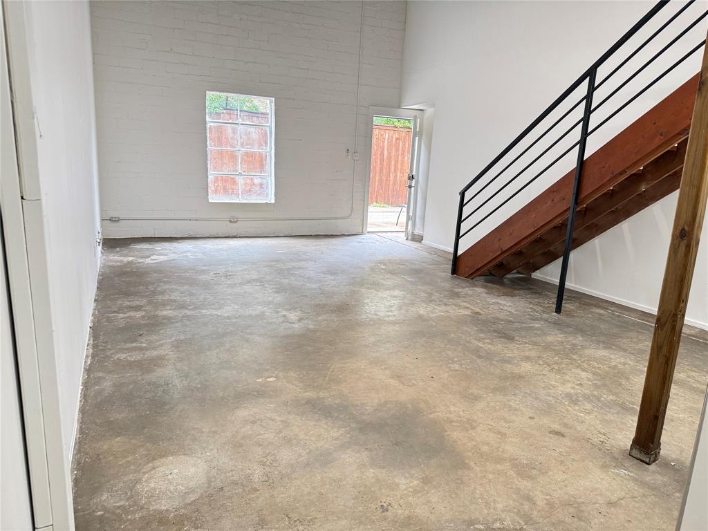 3129 Ross Avenue, Unit 4 Dallas, TX 75204 - Photo 7 of 9 a view of an empty room with stairs