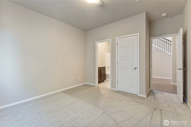 an empty room with closet area