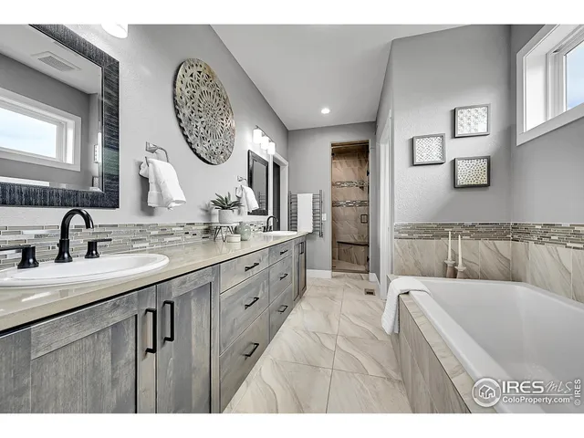 a en suite bathroom with a sink and mirror