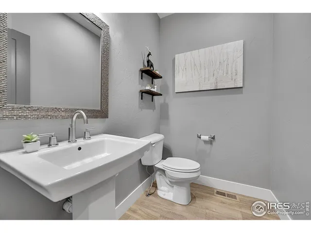 a bedroom with a bed and a desk