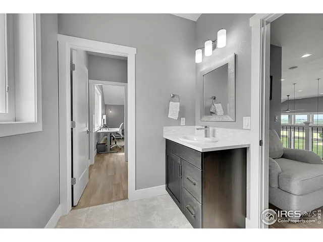 a bathroom with a sink toilet a mirror and shower