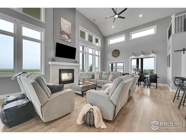 a living room with furniture fireplace and a flat screen tv