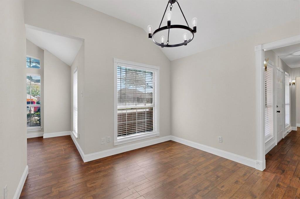 2601 Daisy Lane Rowlett, TX 75089 - Photo 9 of 36 a view of empty room with wooden floor and window