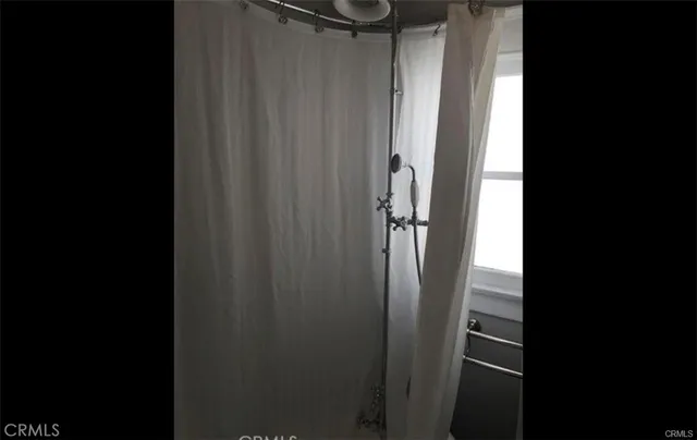 a view of a hallway with washer and dryer