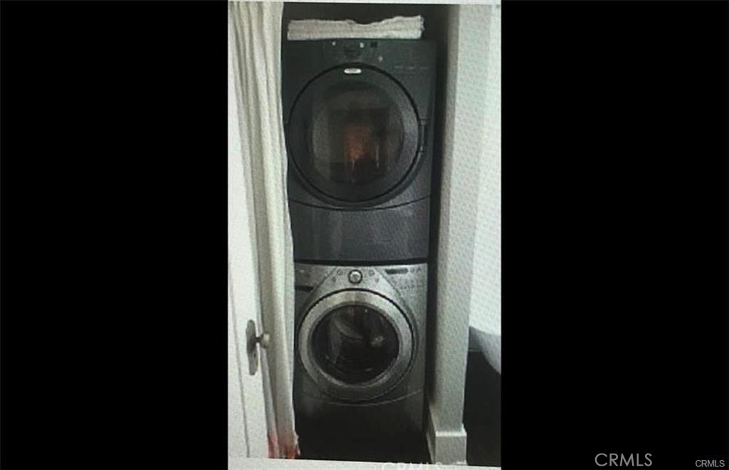 2411 3rd Street, Unit K Santa Monica, CA 90405 - Photo 17 of 18 a view of a hallway with washer and dryer