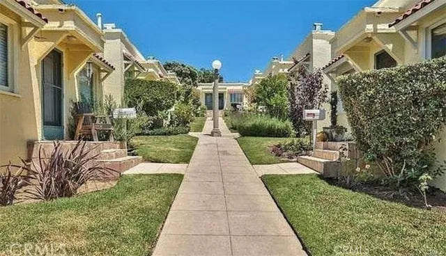 a view of a pathway both side of the house