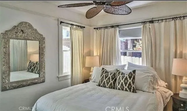 a bedroom with a bed and window