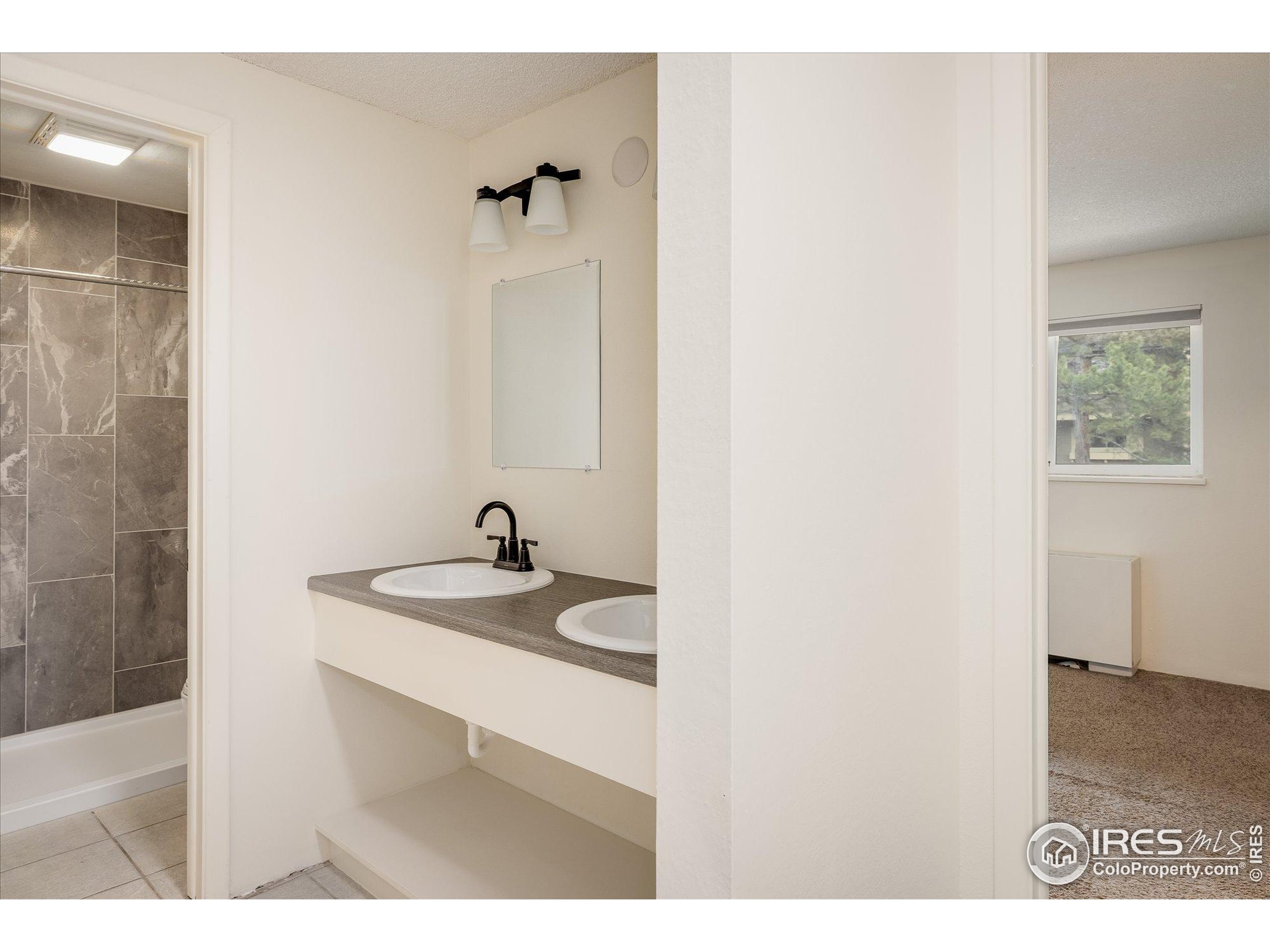 3000 Colorado Avenue, Unit 122 Boulder, CO 80303 - Photo 16 of 31 a bathroom with a sink and a mirror