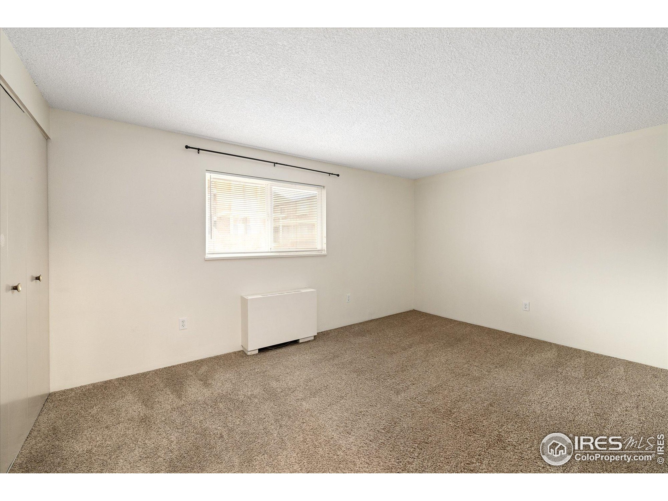 3000 Colorado Avenue, Unit 122 Boulder, CO 80303 - Photo 19 of 31 an empty room with a window