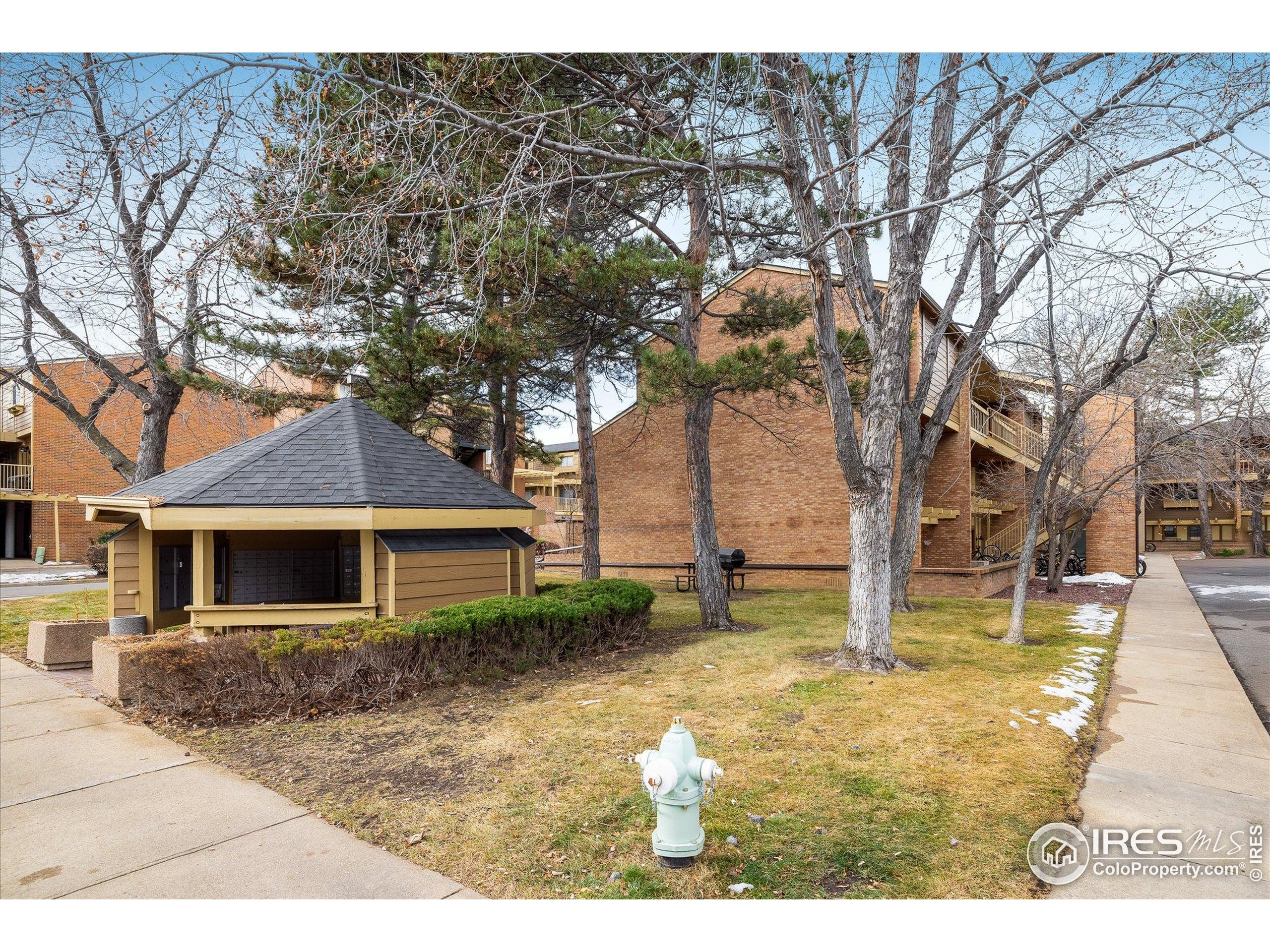 3000 Colorado Avenue, Unit 122 Boulder, CO 80303 - Photo 2 of 31 front view of a house with a tree