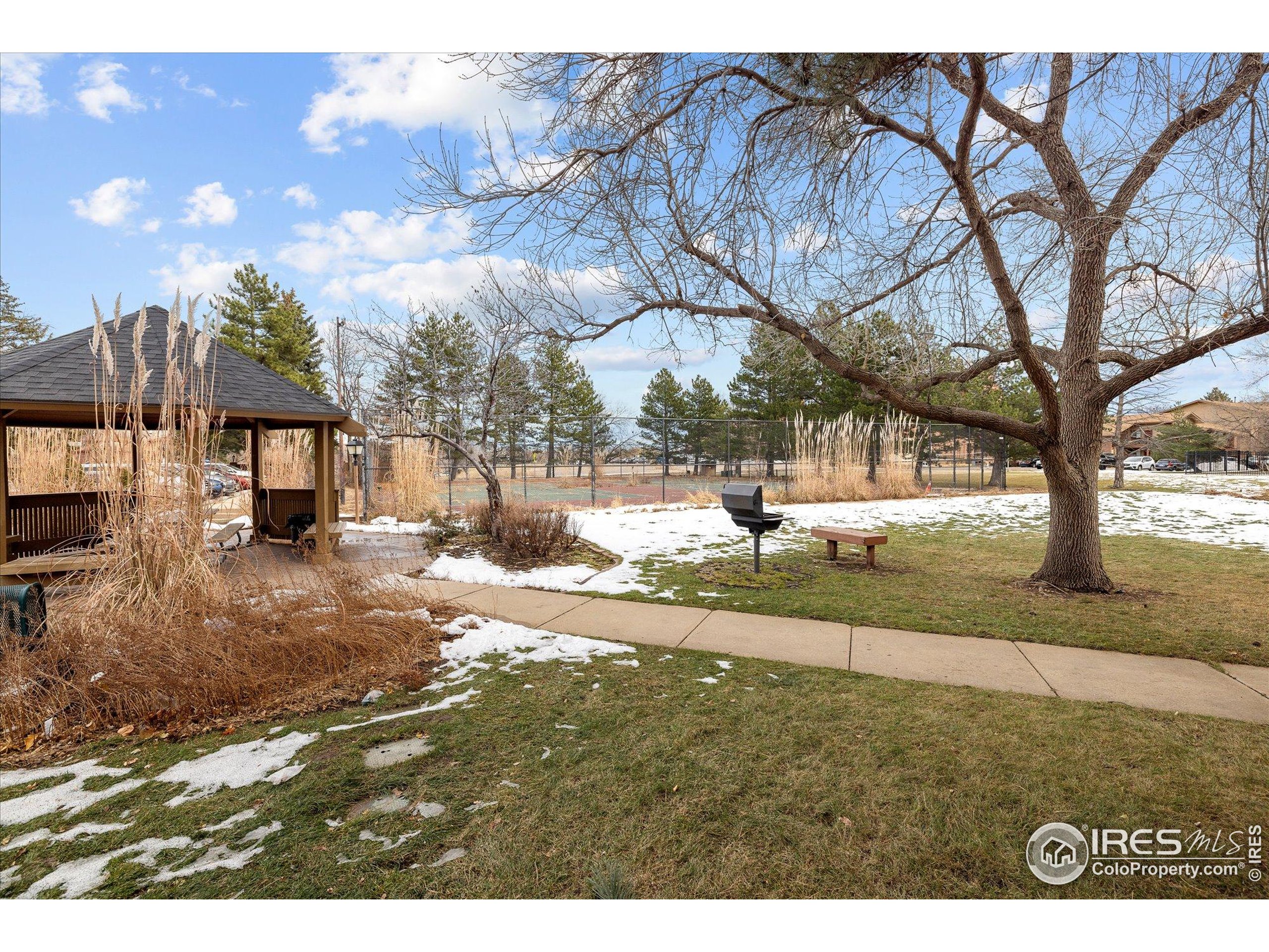 3000 Colorado Avenue, Unit 122 Boulder, CO 80303 - Photo 25 of 31 a view of a yard and front view of a house