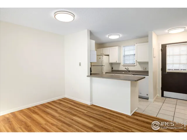 a kitchen with a sink cabinets and window