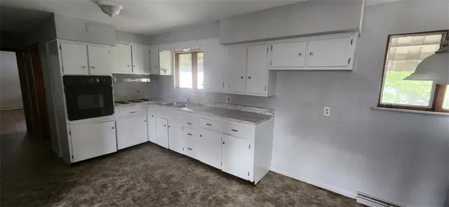 a view of cabinets and wooden floor