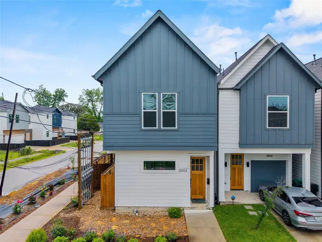 a view of a house with a yard patio and fire pit