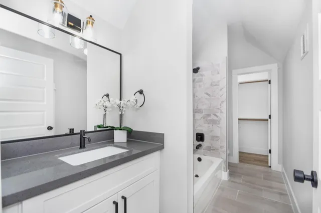 a bathroom with a sink and a mirror