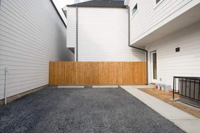 a view of an empty room with a fireplace