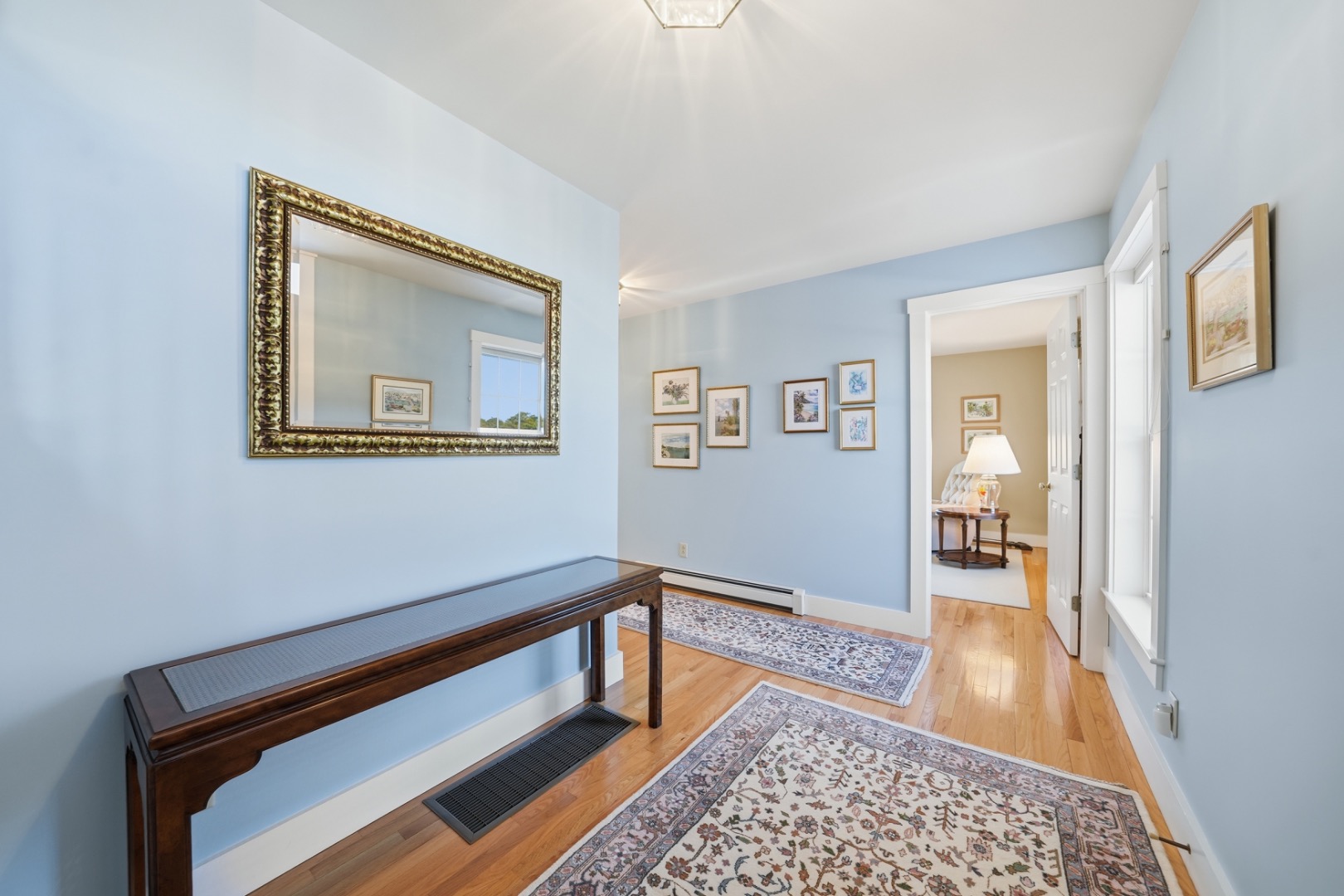 20 Rudder Lane Nantucket, MA 02554 - Photo 30 of 34 a hallway with wooden floor and a rug