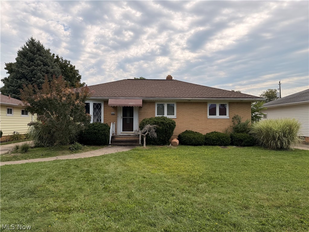 7239 Oakwood Road Parma, OH 44130 - Photo 1 of 14 Brick exterior with a brown shingle roof